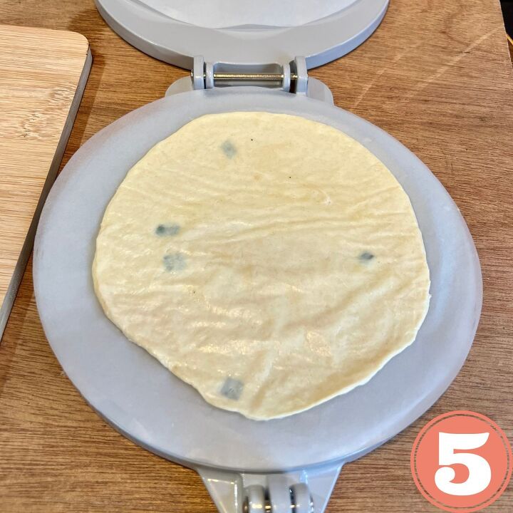 easy vegan flour tortillas using a press, Tortilla dough flattened in a round tortilla press