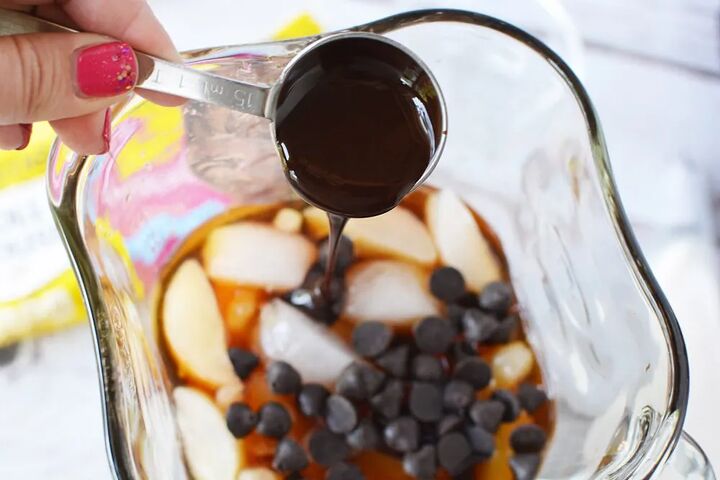 homemade java chip frappuccino recipe, Pouring syrup into a blender on top of ice and chips