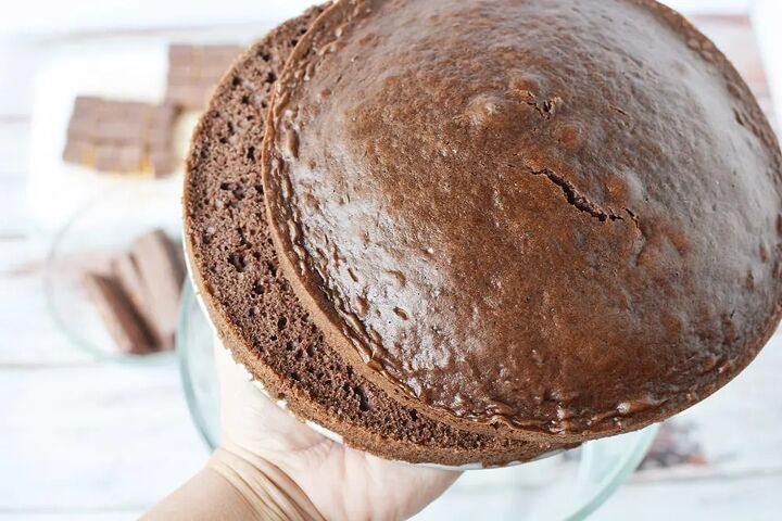 chocolaty chocolate trifle recipe, Holding two sliced chocolate cake rounds