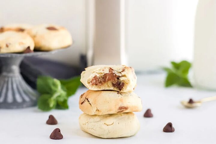 5 minute chocolate chip air fryer cookies, Cookies stacked in front of an air fryer