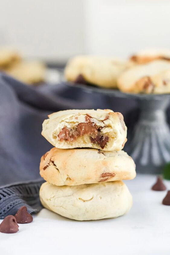 5 minute chocolate chip air fryer cookies, Stack of cookies with one with a bite missing showing a gooey chocolate chip