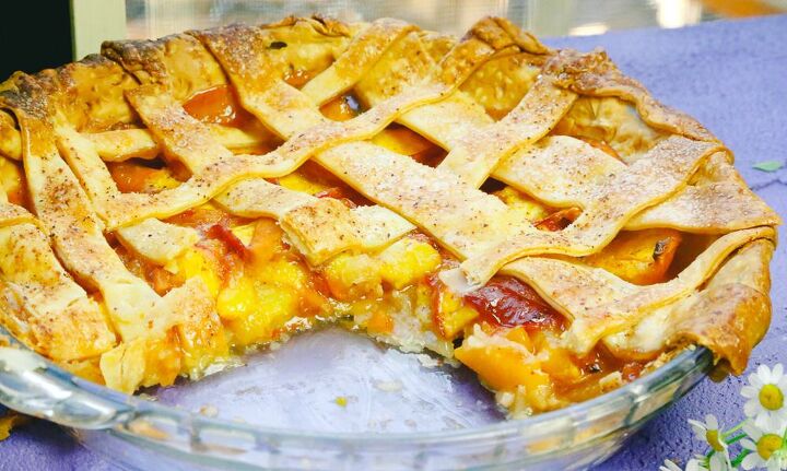 honey peach pie homemade, Honey peach pie with a lattice crust and fresh peach in glass pie plate
