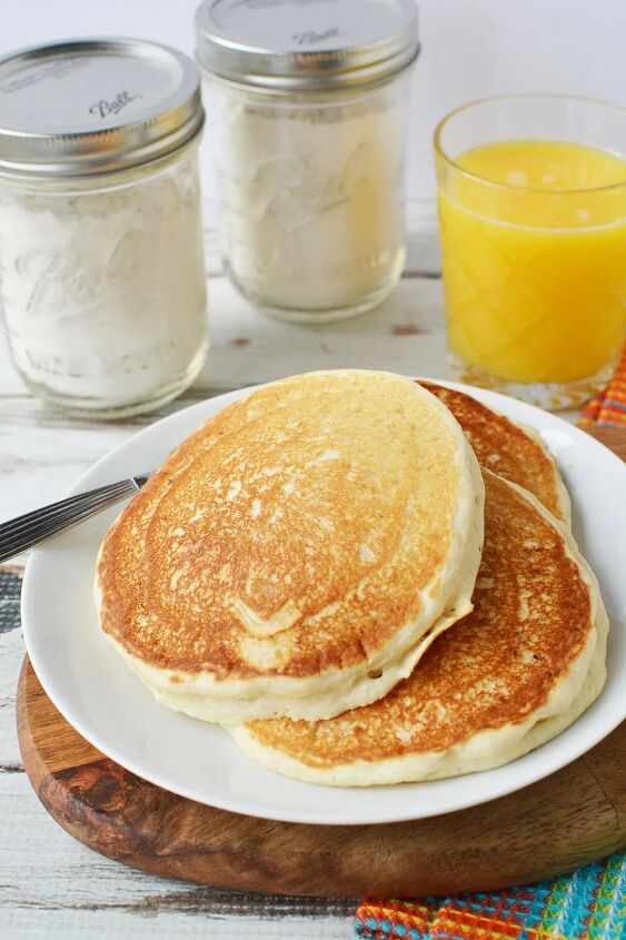 homemade pancake mix recipe to stock your pantry, Pancakes on a plate with mix in the background