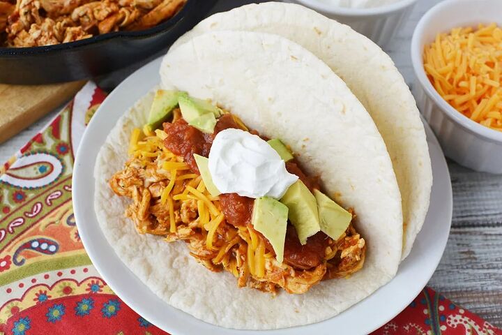 easy and flavorful chicken ranch tacos, Chicken ranch taco in a tortilla with toppings on a plate