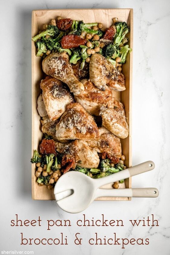 easy sheet pan chicken with broccoli and chickpeas, sheet pan chicken with broccoli and chickpeas in a wooden serving dish with ceramic serving spoons