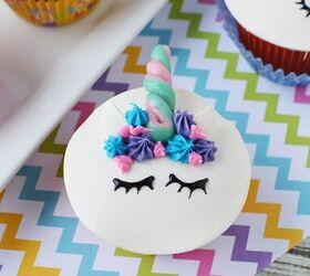 adorable unicorn cupcakes with horns and eyes, A unicorn cupcake with ears a candy horn a frosting mane and eyes