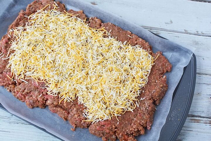 easy cheese stuffed meatloaf comfort food recipe, Meatloaf on sheet pan topped with cheese