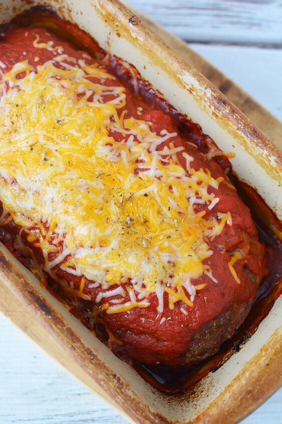 easy cheese stuffed meatloaf comfort food recipe, Cheese and sauce on baked meatloaf in a pan