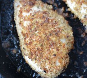 easy parmesan crusted chicken recipe, Chicken coated with bread crumbs frying in pan