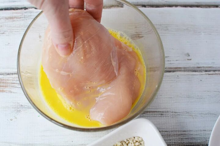 easy parmesan crusted chicken recipe, Dipping raw chicken in to egg