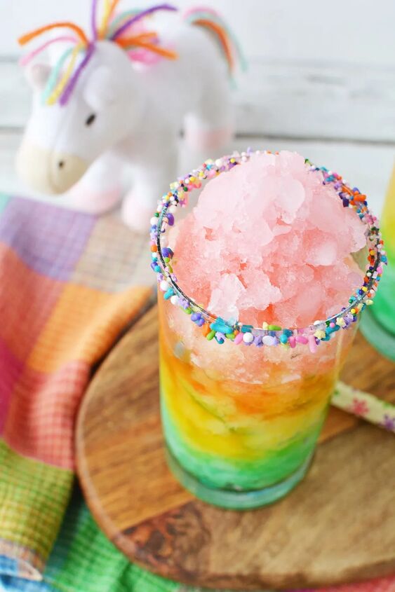 rainbow unicorn slush icy lemonade, Rainbow lemonade with icy layers in a glass