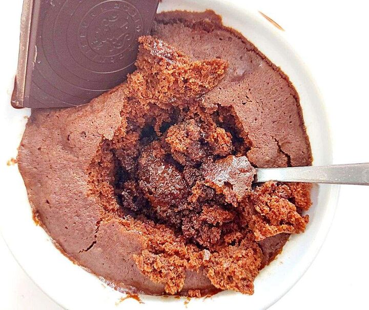 gooey chocolate mug cake that chocolate lovers need in their life, Gooey chocolate mug cake with a square of melted chocolate