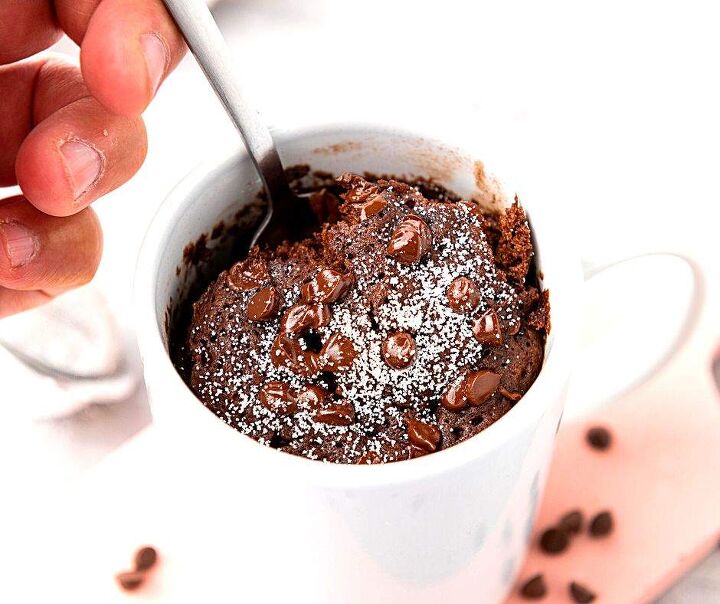 vegan brownie in a mug quick and easy chocolate dessert, vegan mug brownie with spoonful and chocolate chips