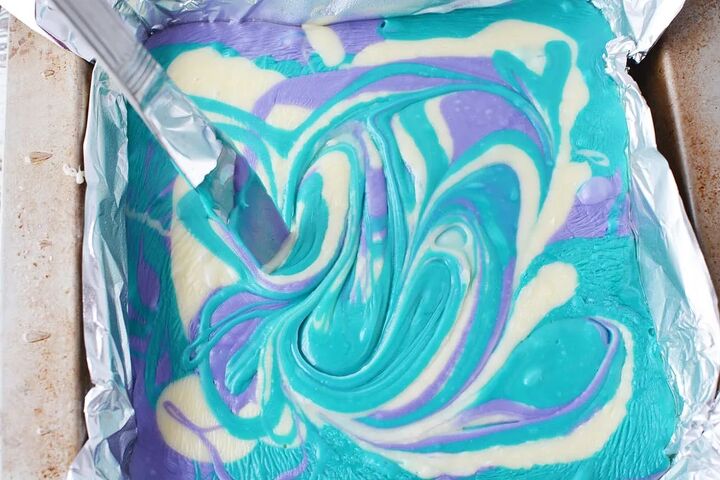 purple and blue swirl mermaid candy fudge, Swirling fudge with knife