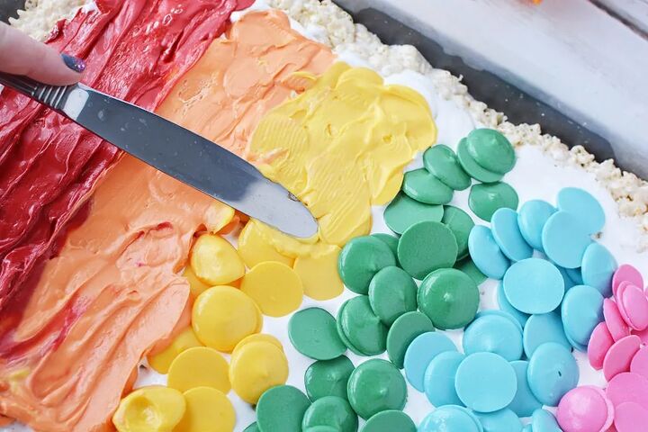 rainbow pinwheel rice krispies treats recipe, Spreading warm candy melts to make a rainbow