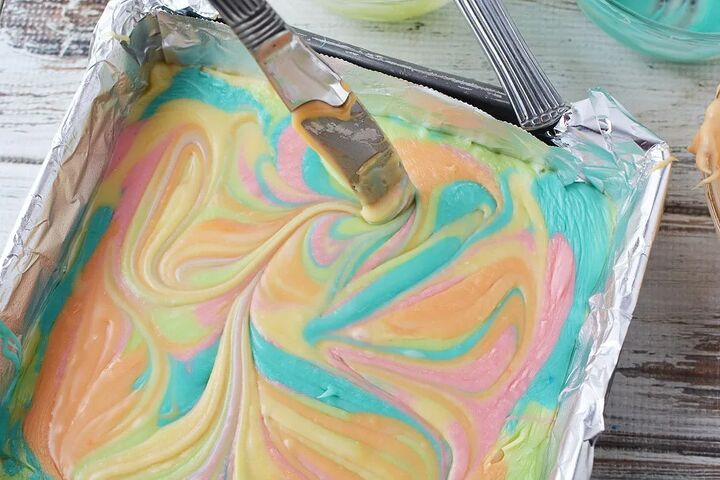 easy rainbow unicorn fudge recipe, Swirling rainbow colors of fudge in a pan