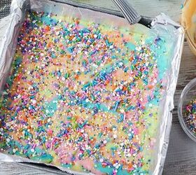 easy rainbow unicorn fudge recipe, Sprinkles on top of fudge in a pan
