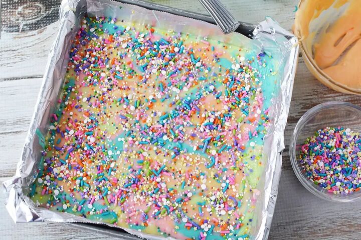 easy rainbow unicorn fudge recipe, Sprinkles on top of fudge in a pan