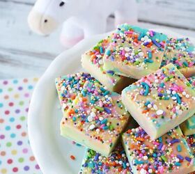 easy rainbow unicorn fudge recipe, Unicorn fudge on a plate with a unicorn plush toy on the table
