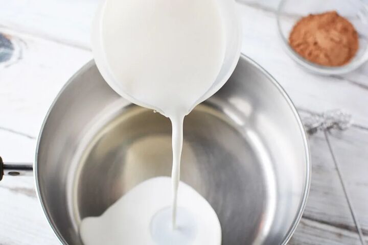 copycat salted caramel mocha drink recipe, Pouring milk into a saucepan