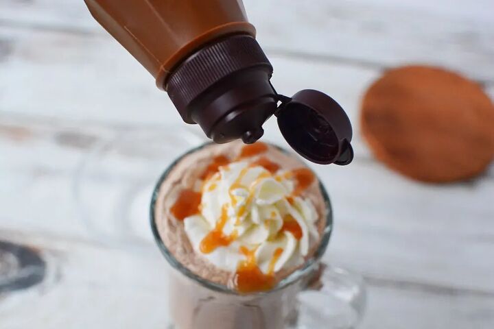 copycat salted caramel mocha drink recipe, Adding caramel drizzle over whipped cream