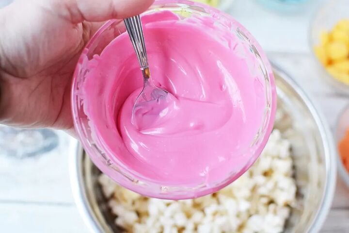 rainbow popcorn snack or party mix, Pink candy melt above popcorn