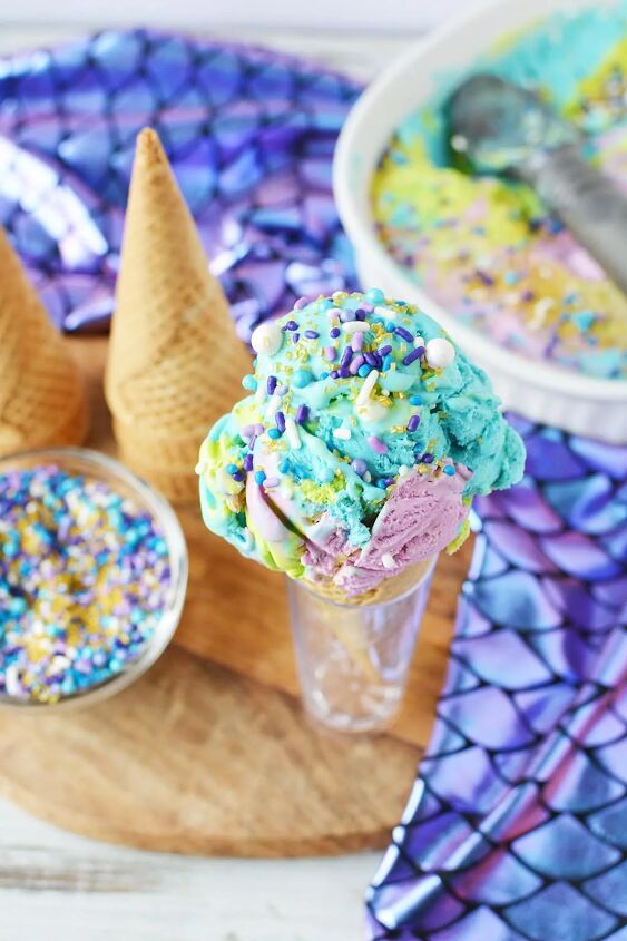 homemade mermaid ice cream recipe, Sprinkles on blue green and purple ice cream with cones and dish in the background