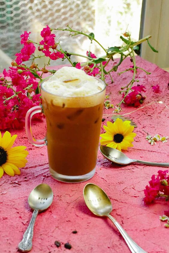 italian iced coffee shakerato, Foam topped iced coffee made with sweetened condensed milk coconut syrup shakerato iced coffee with metal spoons