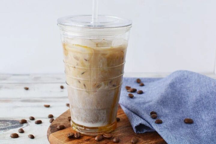 easy homemade iced caramel macchiato recipe, Coffee drink surrounded by coffee beans