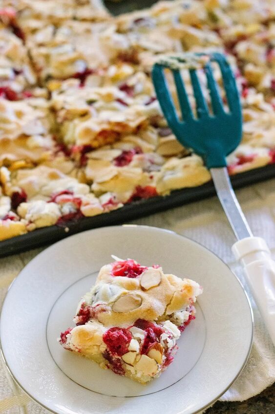 cranberry cake with almonds, Cranberry cake on a plate with pan and spatula
