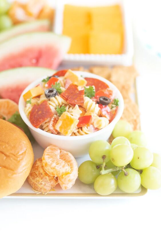 the throwback creamy pasta salad everyone will rave about, bbqterie tray with bowl of pasta salad fresh fruits