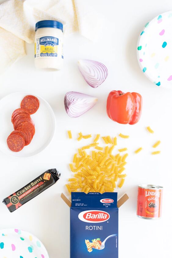 the throwback creamy pasta salad everyone will rave about, pasta salad ingredients laid out on table Dry pasta cheese brick whole pepper hellmann s mayo