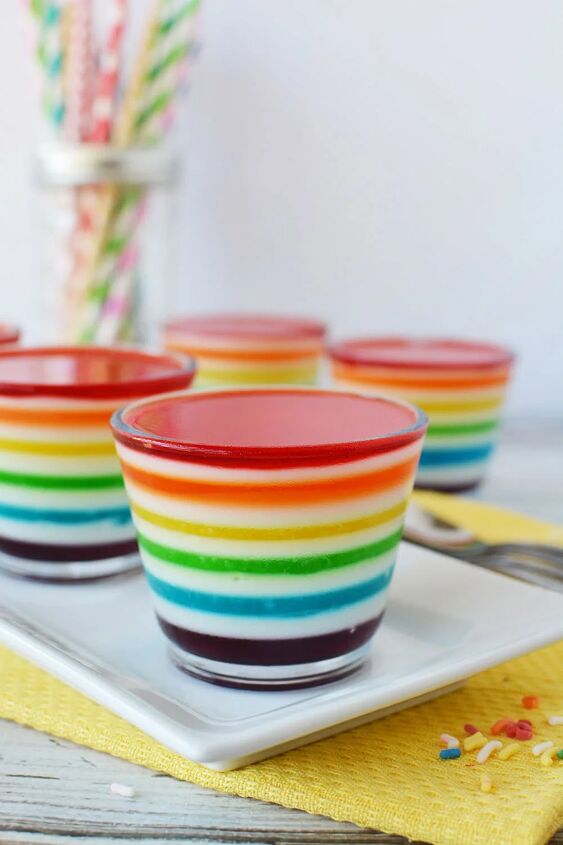 layered rainbow gelatin cups, Cups of rainbow Jell o layers on a table