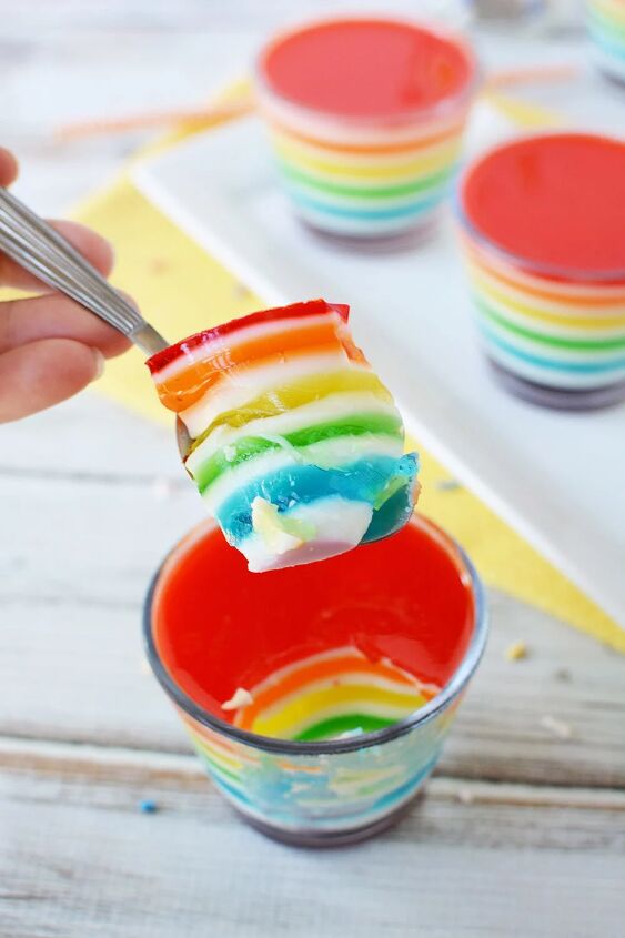 layered rainbow gelatin cups, Spoonful of rainbow layered Jell o that shows all the colors