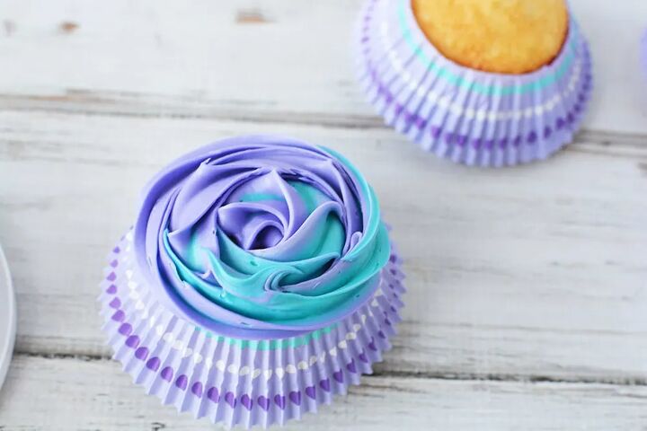 fairy cupcakes with wings, Blue and purple swirled frosting on a cupcake
