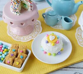 mini fairy cakes tea party, Tiny cakes sitting on a table with a tea party set and other small treats