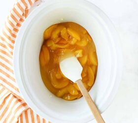slow cooker peach cobbler, Canned peaches in a white slow cooker insert