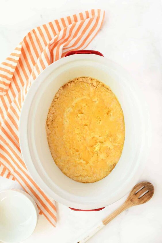 slow cooker peach cobbler, Slow cooked peach cobbler in a white slow cooker