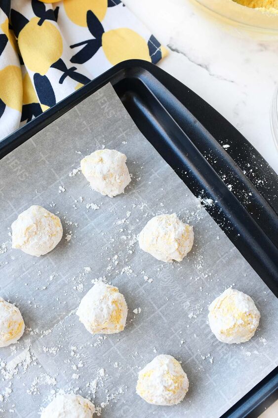 lemon cookies made with cool whip a perfect summer treat, Lemon cake mix balls on a baking sheet