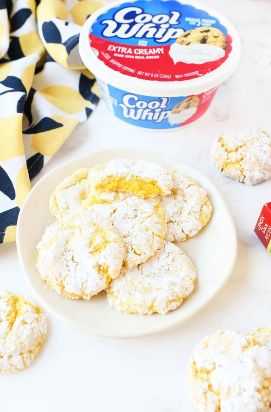lemon cookies made with cool whip a perfect summer treat, A bitten Lemon Cool Whip Cookie on a platter
