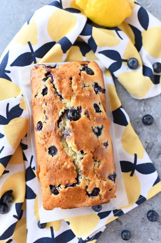 blueberry lemon pound cake loaf, A golden brown blueberry lemon loaf on a lemon napkin