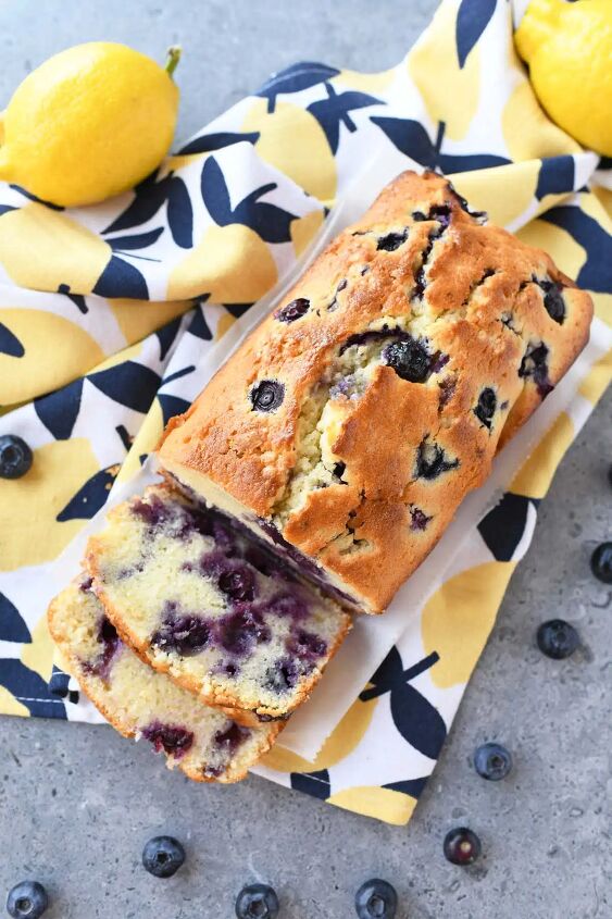 blueberry lemon pound cake loaf, A sliced lemon blueberry pound cake on a lemon napkin