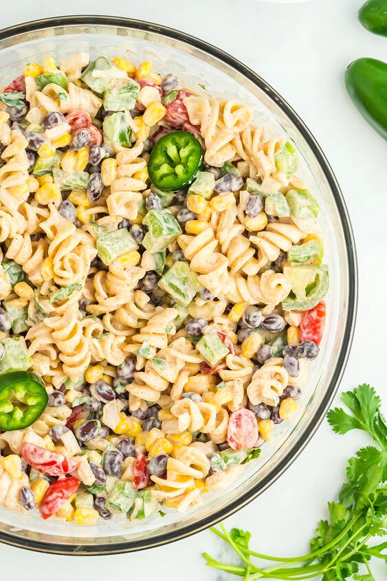 southwest pasta salad, up close over the top pasta salad photo with sliced jalape os to decorate
