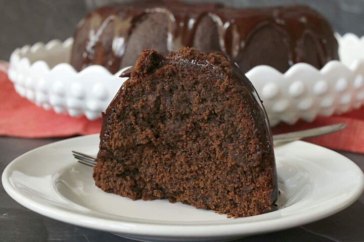 beer cake, A slice of chocolate cake on a white plate