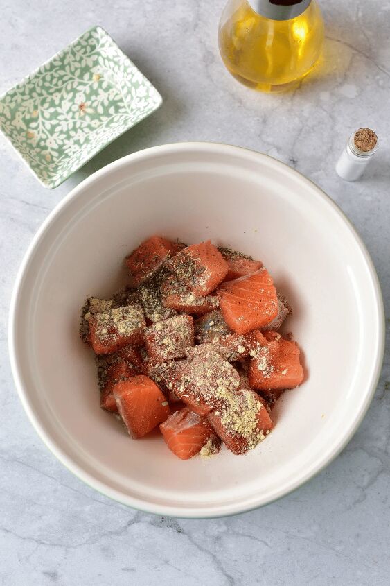 air fryer salmon cubes, air fryer salmon bites in bowl with spices