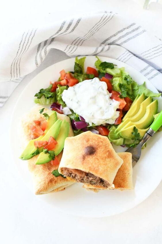 how to make beef chimichanga quick and easy, A colorful plate of beef chimichangas on a white plate with a striped napkin