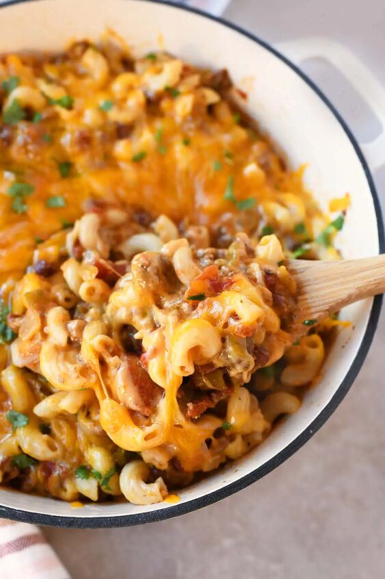 delicious ground beef chili mac cheese, Cheesy chili mac on a wooden spoon