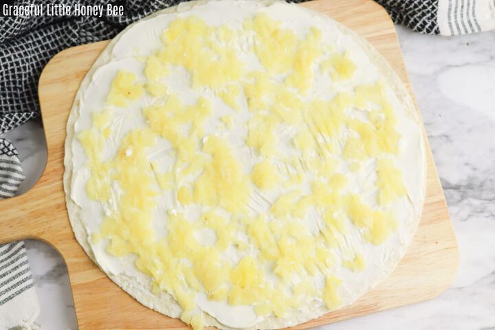Tortilla with cream cheese and pineapple on top