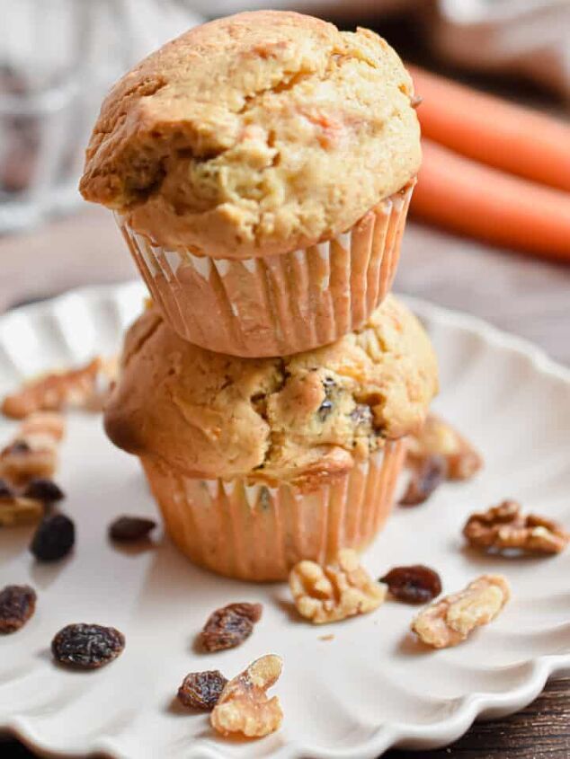 the best banana blueberry muffins so moist, Two carrot cake muffins are stacked on top of each other