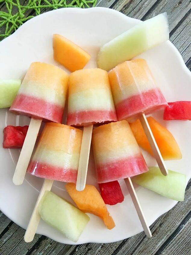layered triple melon popsicles recipe, Layered melon popsicles on a plate
